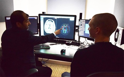 Penn Neuroradiology: Suyash Mohan in reading room with fellow